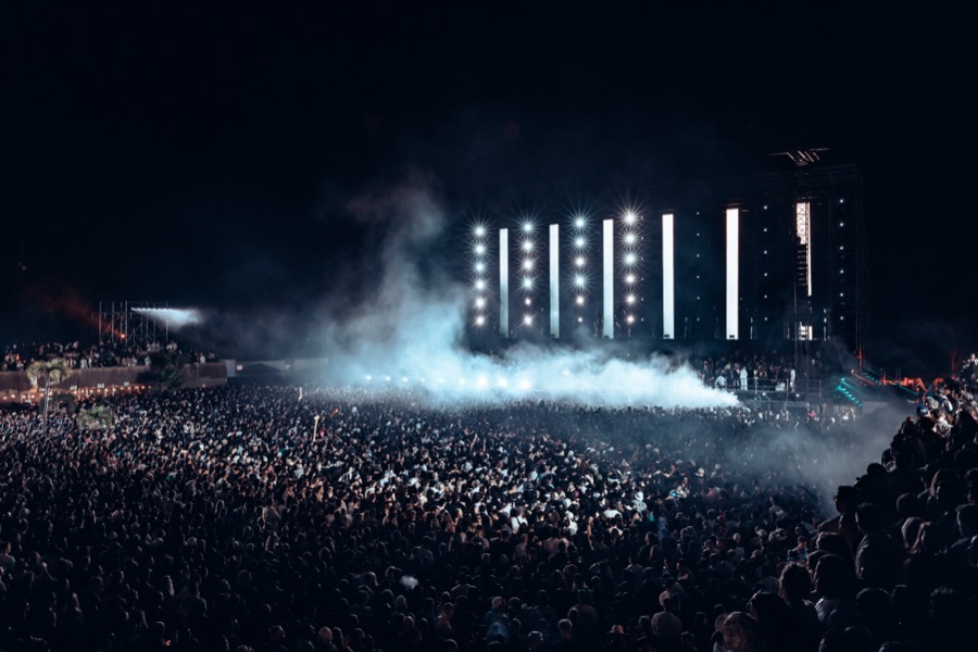 Concert crowd with hands raised